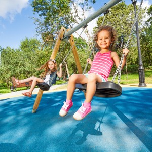 kids playing on a swing set